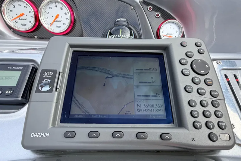 Slide: The Image of Garmin GPS display on 2011 Sunsation F4 boat dashboard with gauges. - 56