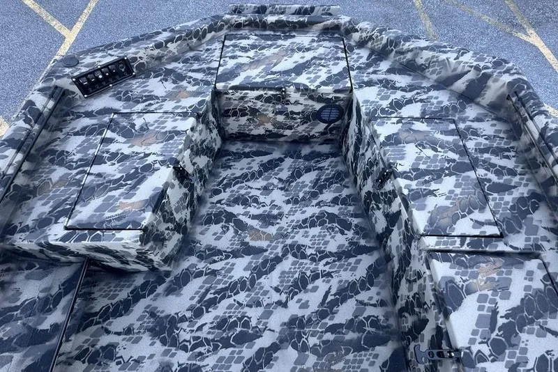 Slide: The Image of Camouflage interior of 2025 Havoc 1860 boat with storage compartments. - 10