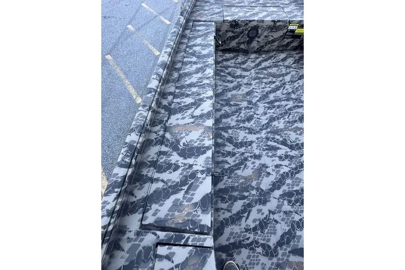 Slide: The Image of 2025 Havoc 1860 boat interior with camouflage pattern flooring. - 14