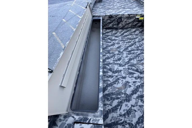 Slide: The Image of 2025 Havoc 1860 boat interior with camouflage pattern and storage compartment. - 16