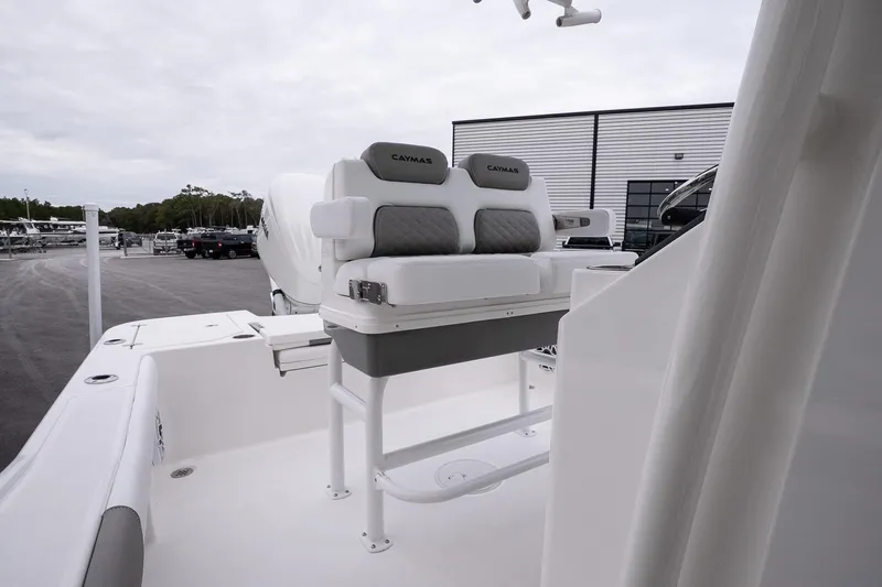 Slide: The Image of 2026 Caymas 24 HB boat interior with cushioned seating and sleek design. - 15