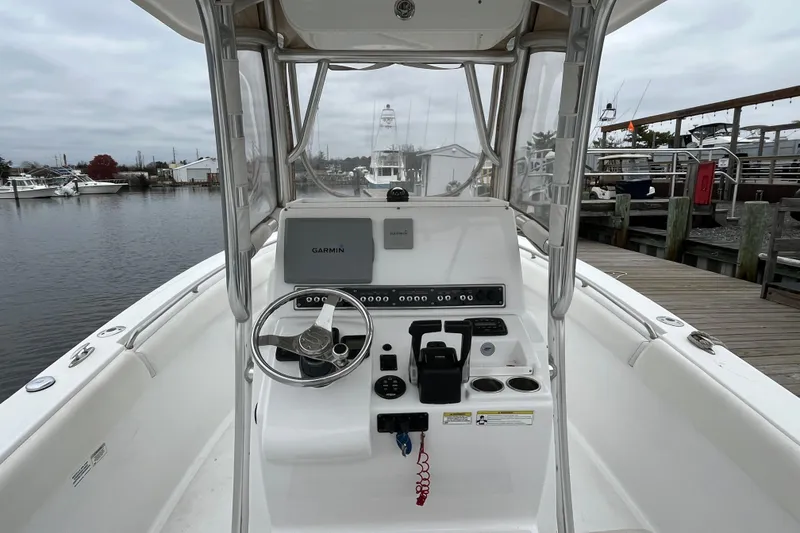 Slide: The Image of 2014 Sportsman Heritage 251 Center Console boat at dock, featuring Garmin navigation system. - 3