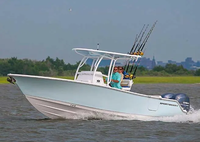 Slide: The Image of Manufacturer Provided Image: 2014 Sportsman Heritage 251 Center Console boat cruising on water. - 7