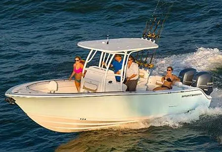 Slide: The Image of Manufacturer Provided Image: 2014 Sportsman Heritage 251 Center Console boat cruising on the water with passengers. - 8