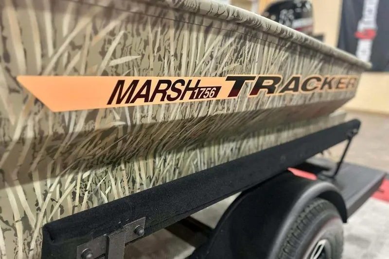 Slide: The Image of 2026 Tracker Grizzly 1756 T Marsh boat with camouflage design on trailer. - 15