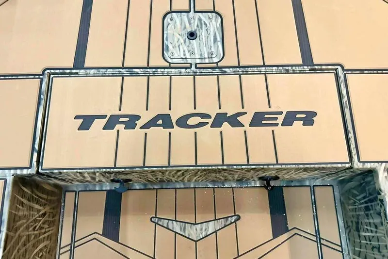 Slide: The Image of 2026 Tracker Grizzly 1756 T Marsh boat deck with logo and design details. - 9