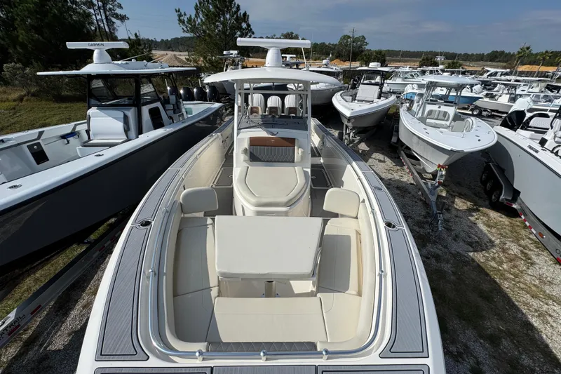 Slide: The Image of 2022 Cobia 350 Center Console boat displayed among other boats in a marina. - 16
