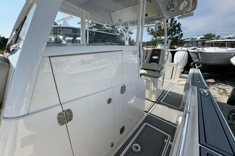Slide: The Image of 2022 Cobia 350 Center Console boat interior with seating and storage compartments. - 18