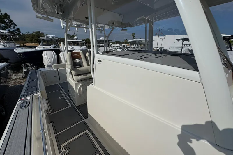 Slide: The Image of 2022 Cobia 350 Center Console boat with sleek design and spacious deck. - 19