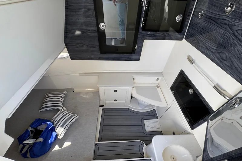 Slide: The Image of 2022 Cobia 350 Center Console cabin interior with modern amenities and sleek design. - 20