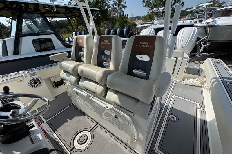 Slide: The Image of 2022 Cobia 350 Center Console boat interior with luxurious seating and modern design. - 26