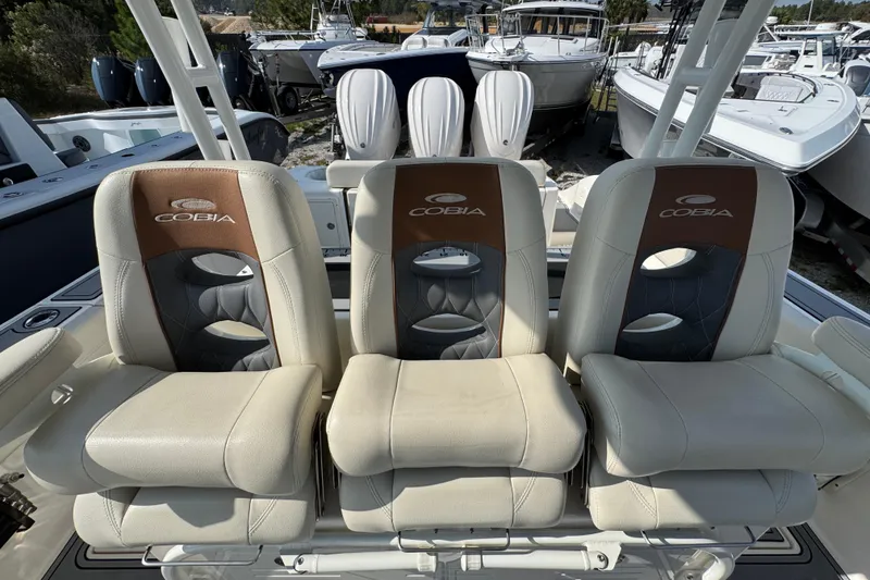 Slide: The Image of 2022 Cobia 350 Center Console boat seats, featuring luxurious design and branding. - 27