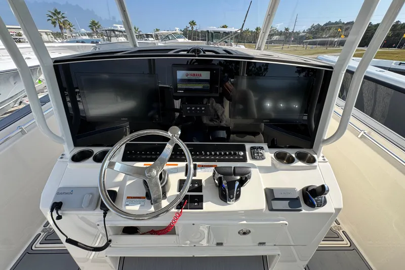 Slide: The Image of 2022 Cobia 350 Center Console helm with advanced navigation and control systems. - 30