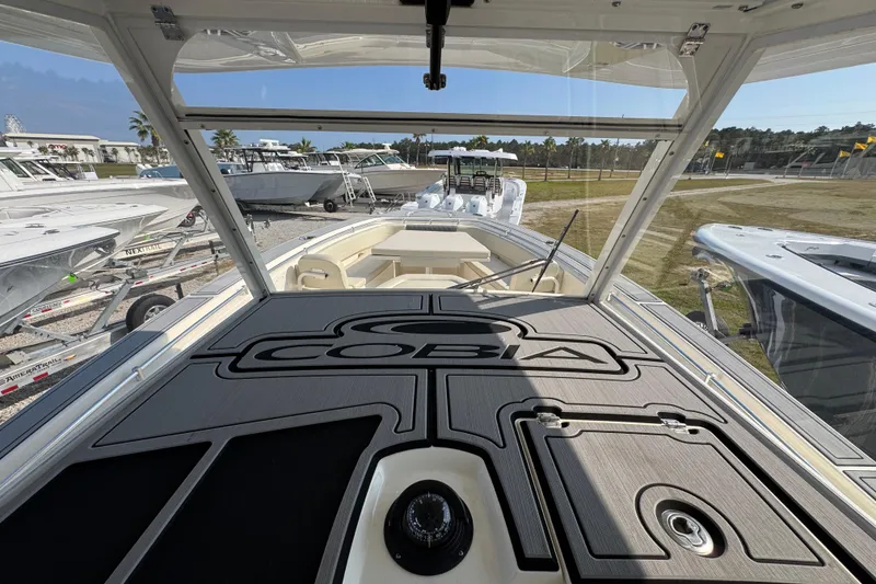 Slide: The Image of 2022 Cobia 350 Center Console boat interior view at a marina. - 33
