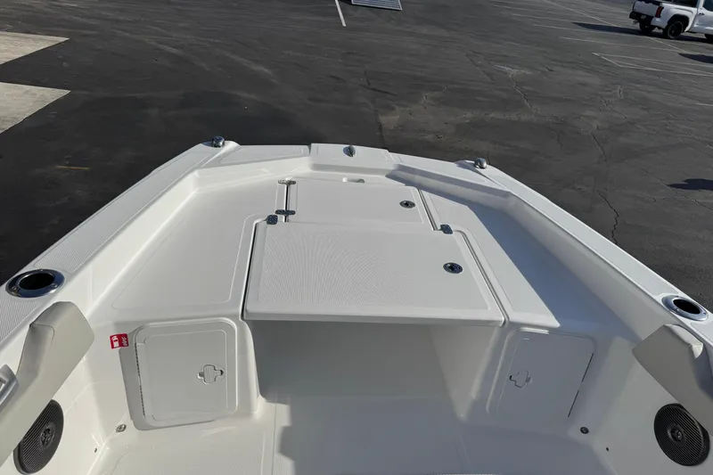 Slide: The Image of 2026 Scarab 235 Open SE boat deck, featuring storage compartments and cup holders. - 12