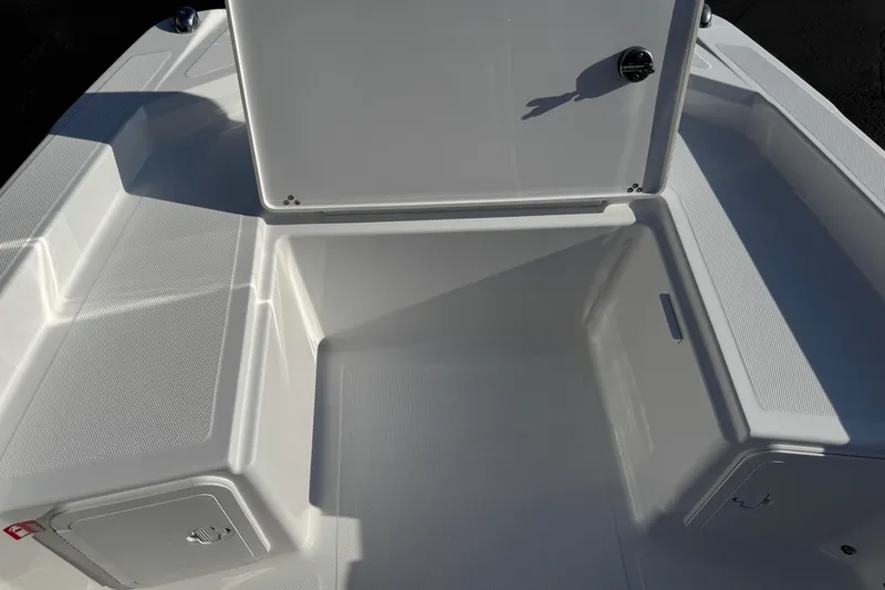 Slide: The Image of 2026 Scarab 235 Open SE boat storage compartment with open hatch, showcasing spacious interior. - 18