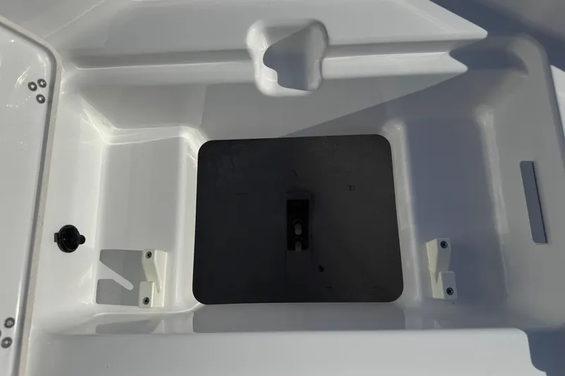 Slide: The Image of Interior view of 2026 Scarab 235 Open SE boat compartment, showcasing storage space. - 19