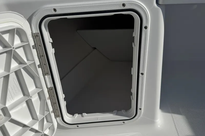 Slide: The Image of Open storage compartment on 2026 Scarab 235 Open SE boat. - 24