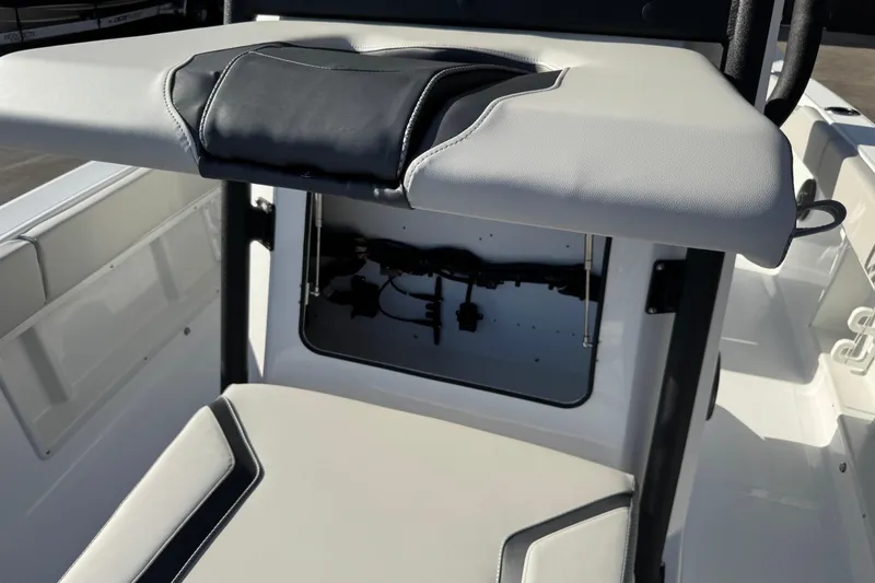 Slide: The Image of 2026 Scarab 235 Open SE boat interior with storage compartment and cushioned seating. - 31