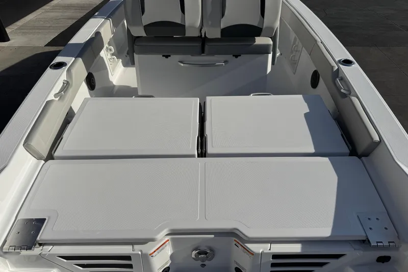 Slide: The Image of 2026 Scarab 235 Open SE boat interior with cushioned seating and storage compartments. - 32