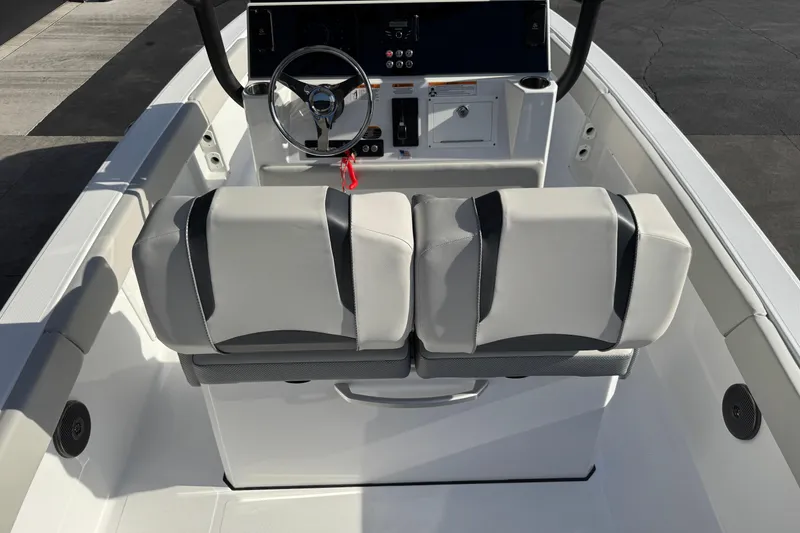 Slide: The Image of 2026 Scarab 235 Open SE boat interior with dual seats and steering console. - 34