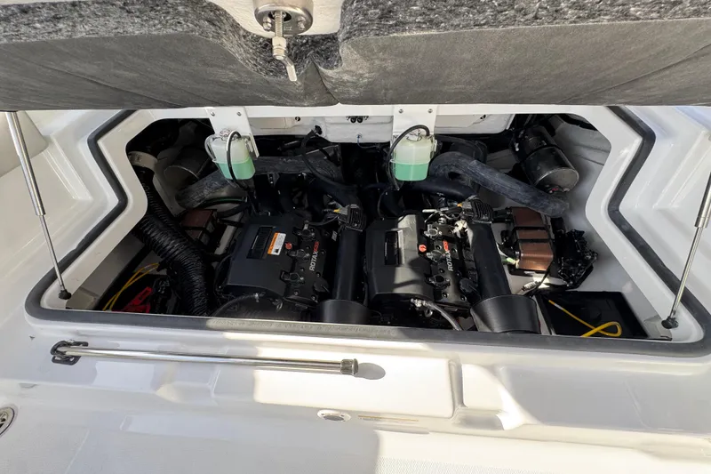 Slide: The Image of Engine compartment of 2026 Scarab 235 Open SE boat, showcasing dual Rotax engines. - 39