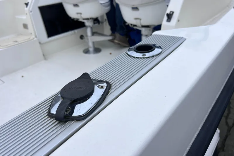 Slide: The Image of 1993 Bayliner Trophy Walkaround boat deck with seating and hardware details. - 23