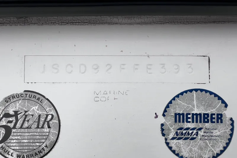 Slide: The Image of Bayliner 2002 Trophy Walkaround 1993 hull identification number and warranty stickers. - 6