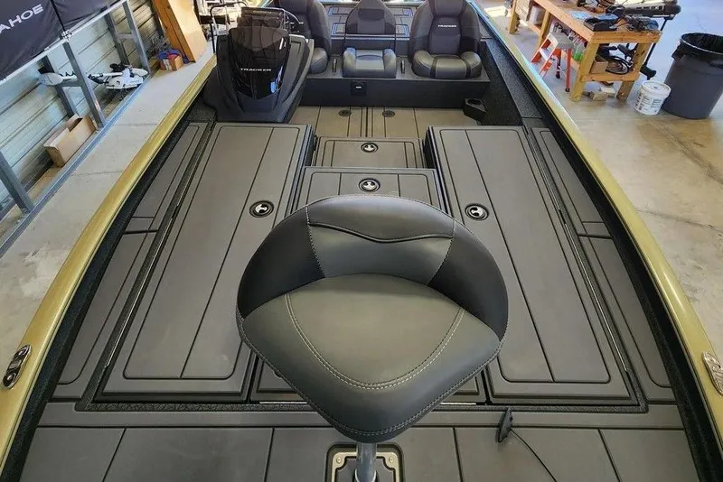Slide: The Image of 2026 Tracker Savage 215 boat interior with seating and storage compartments. - 11