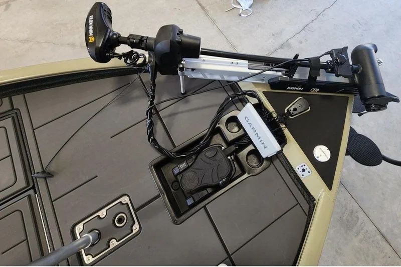 Slide: The Image of 2026 Tracker Savage 215 boat deck with Garmin and Minn Kota equipment. - 9