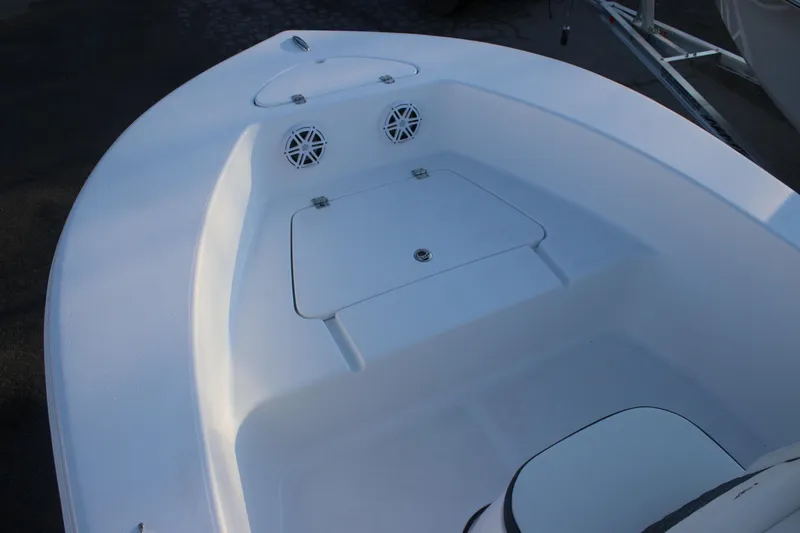 Slide: The Image of 2026 Tidewater 180 CC Adventure boat interior with storage compartment and speakers. - 10