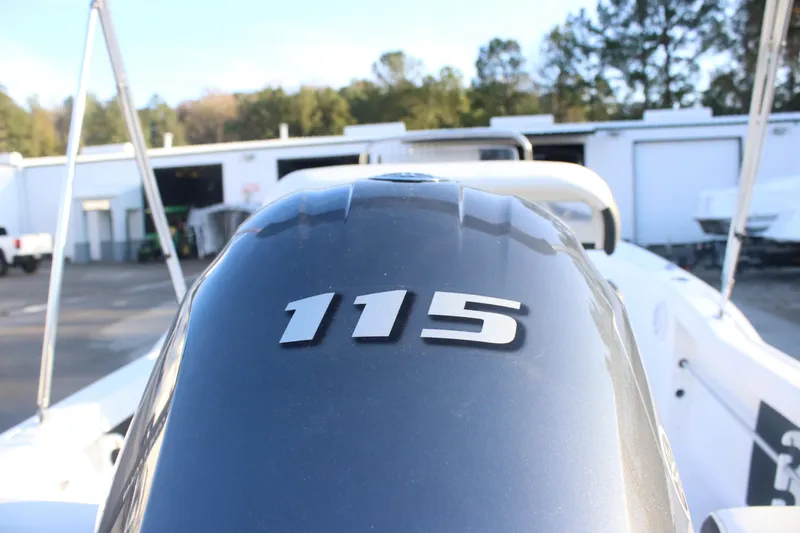 Slide: The Image of 2026 Tidewater 180 CC Adventure boat with 115 horsepower engine in a marina setting. - 15