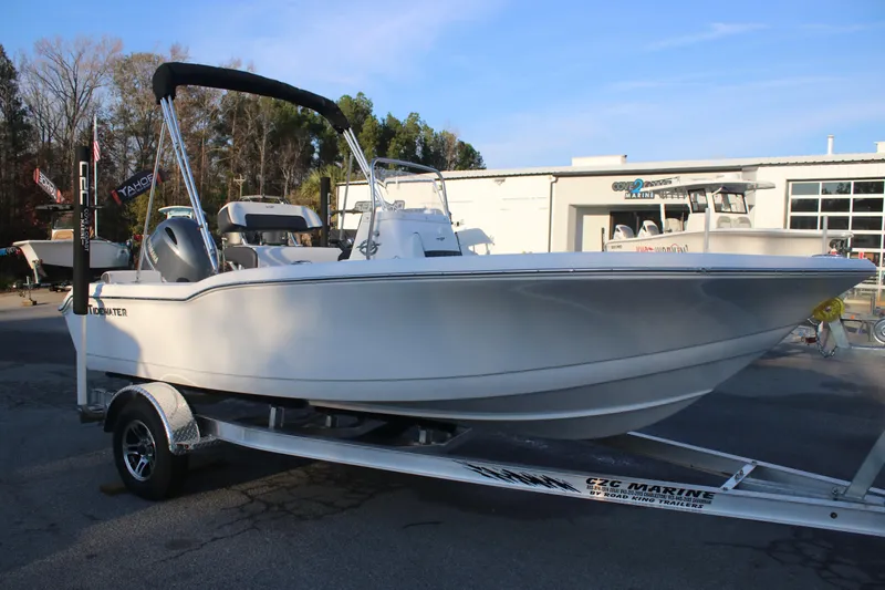 Slide: The Image of 2026 Tidewater 180 CC Adventure boat on trailer, parked outdoors. - 2