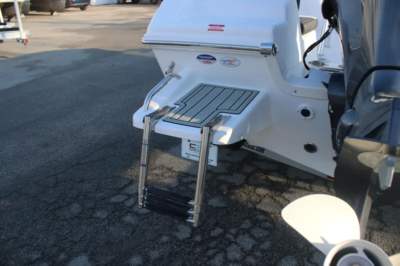 Slide: The Image of 2026 Tidewater 180 CC Adventure boat with swim platform and ladder. - 4