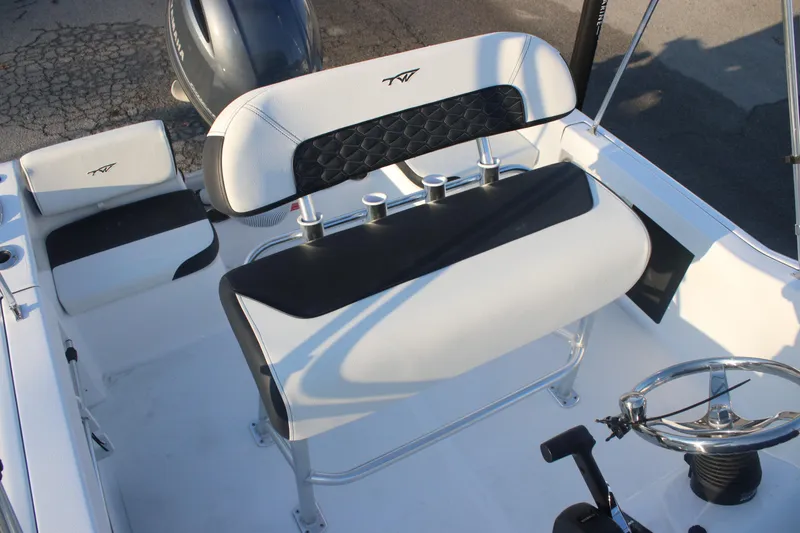 Slide: The Image of 2026 Tidewater 180 CC Adventure boat interior with seating and steering wheel. - 6