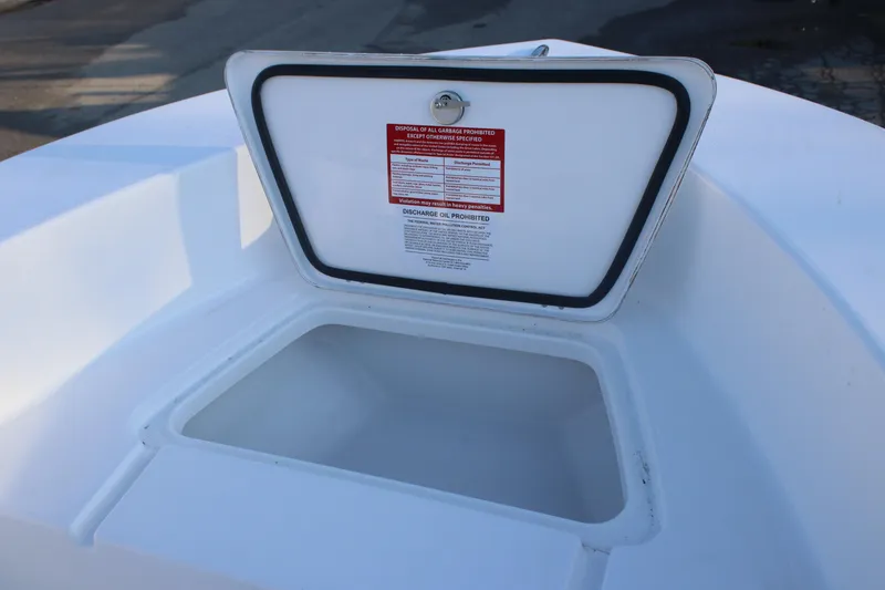 Slide: The Image of Open storage compartment on 2026 Tidewater 180 CC Adventure boat. - 7