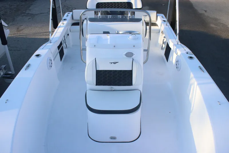 Slide: The Image of 2026 Tidewater 180 CC Adventure boat interior with seating and console, viewed from above. - 8
