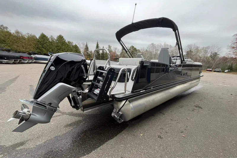 Slide: The Image of 2026 Avalon Catalina Versatile Rear Bench pontoon boat with powerful outboard motor. - 4