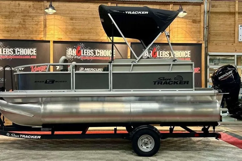 The Image of 2026 Sun Tracker Bass Buggy 16 XL Select pontoon boat on display indoors. - 1