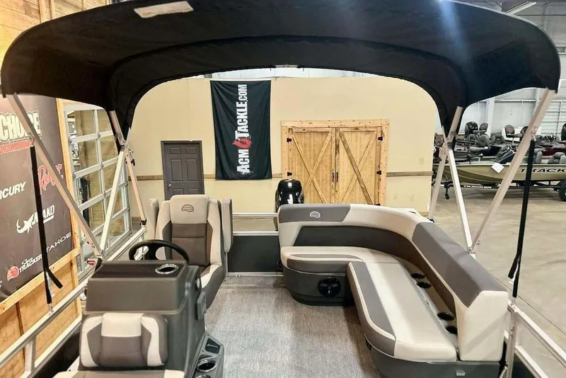 Slide: The Image of 2026 Sun Tracker Bass Buggy 16 XL Select pontoon boat interior with seating and canopy. - 11