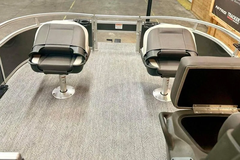 Slide: The Image of 2026 Sun Tracker Bass Buggy 16 XL Select interior with swivel seats and storage compartments. - 12