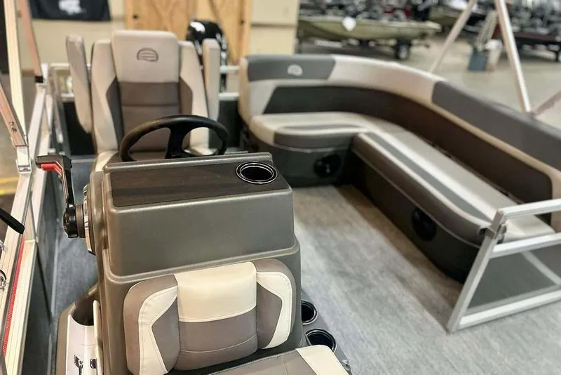 Slide: The Image of Interior of 2026 Sun Tracker Bass Buggy 16 XL Select pontoon boat with seating and steering console. - 14