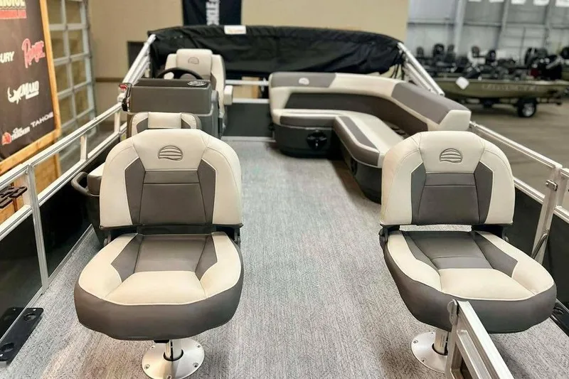 Slide: The Image of 2026 Sun Tracker Bass Buggy 16 XL Select pontoon boat interior with plush seating. - 17