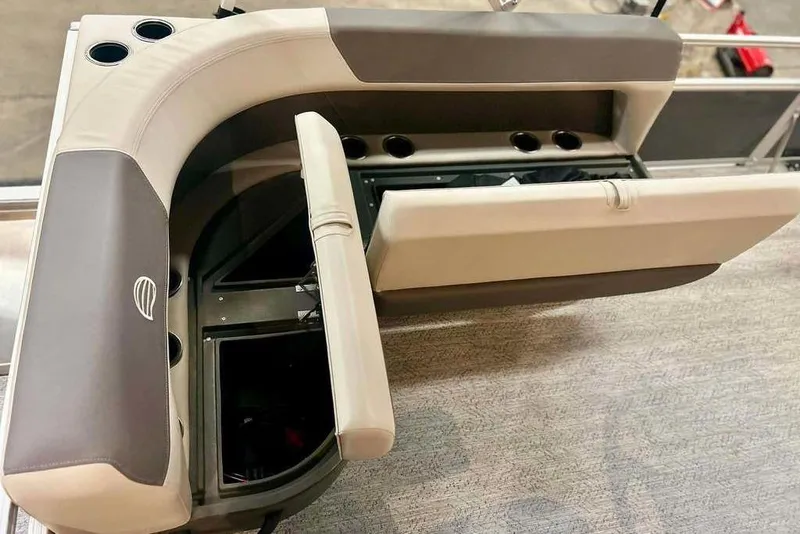 Slide: The Image of 2026 Sun Tracker Bass Buggy 16 XL Select boat seating with cup holders and storage compartments. - 6