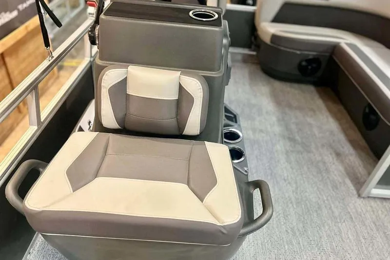 Slide: The Image of 2026 Sun Tracker Bass Buggy 16 XL Select interior with cushioned seating and cup holders. - 9