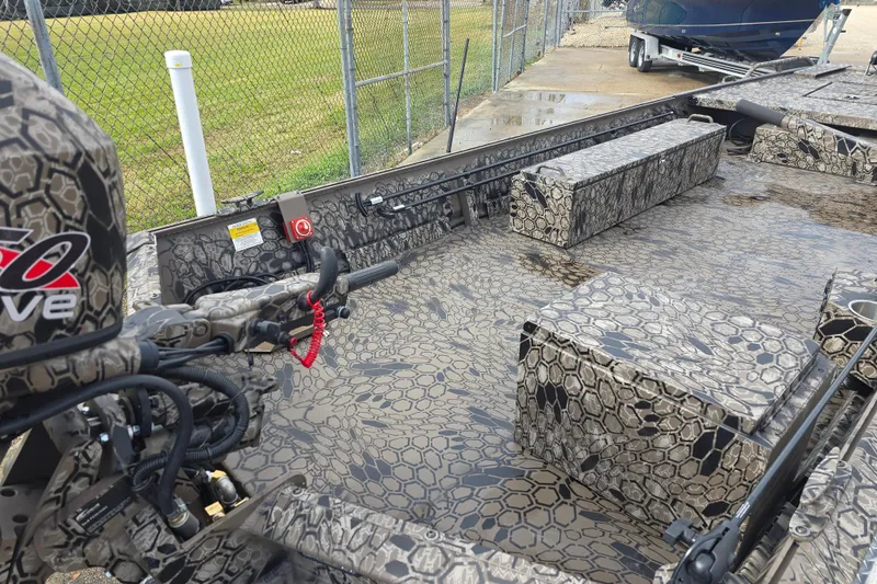 Slide: The Image of 2026 Pro-Drive 1854 boat with camouflage pattern, featuring a powerful motor and spacious interior. - 10