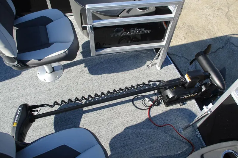 Slide: The Image of 2026 Sun Tracker Fishin' Barge 20 DLX interior with Minn Kota trolling motor. - 14