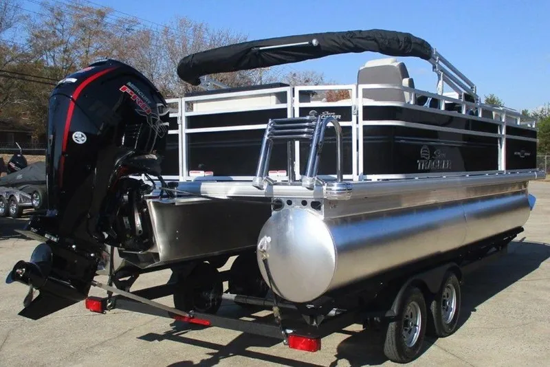Slide: The Image of 2026 Sun Tracker Fishin' Barge 20 DLX pontoon boat with powerful outboard motor. - 7