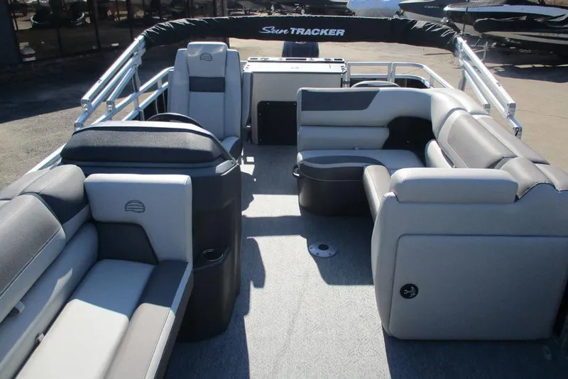 Slide: The Image of 2026 Sun Tracker Fishin' Barge 20 DLX interior with spacious seating and modern design. - 9