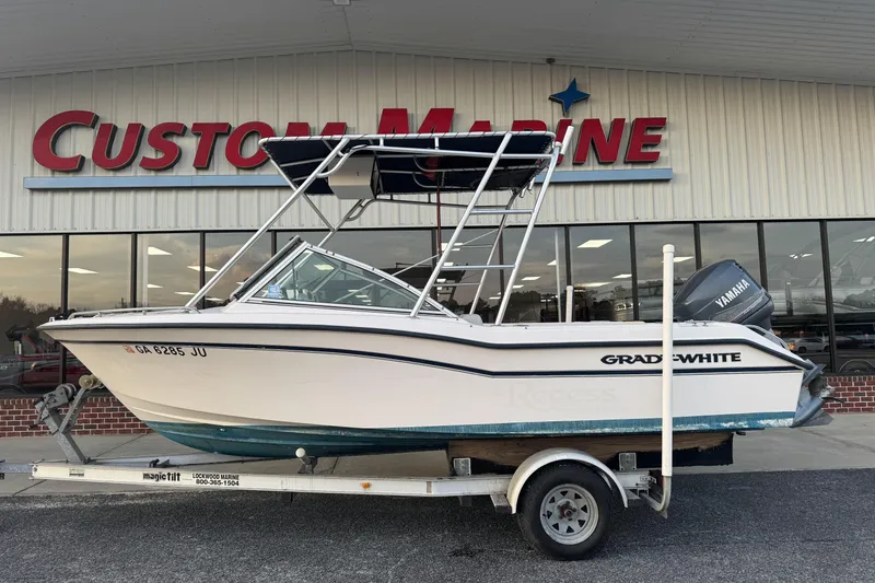 The Image of 2001 Grady-White Freedom 192 boat on trailer at Custom Marine dealership. - 1